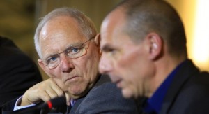 Wolfgang Schaeuble, Germany's finance minister, left, looks towards Yanis Varoufakis, Greece's finance minister, during a news conference at the Chancellery in Berlin, Germany, on Thursday, Feb. 5, 2015. The meeting comes hours after Greece lost a critical funding artery when the European Central Bank restricted loans to its financial system. Photographer: Krisztian Bocsi/Bloomberg *** Local Caption *** Yanis Varoufakis; Wolfgang Schaeuble