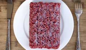 Table setting with frozen ground lean beef